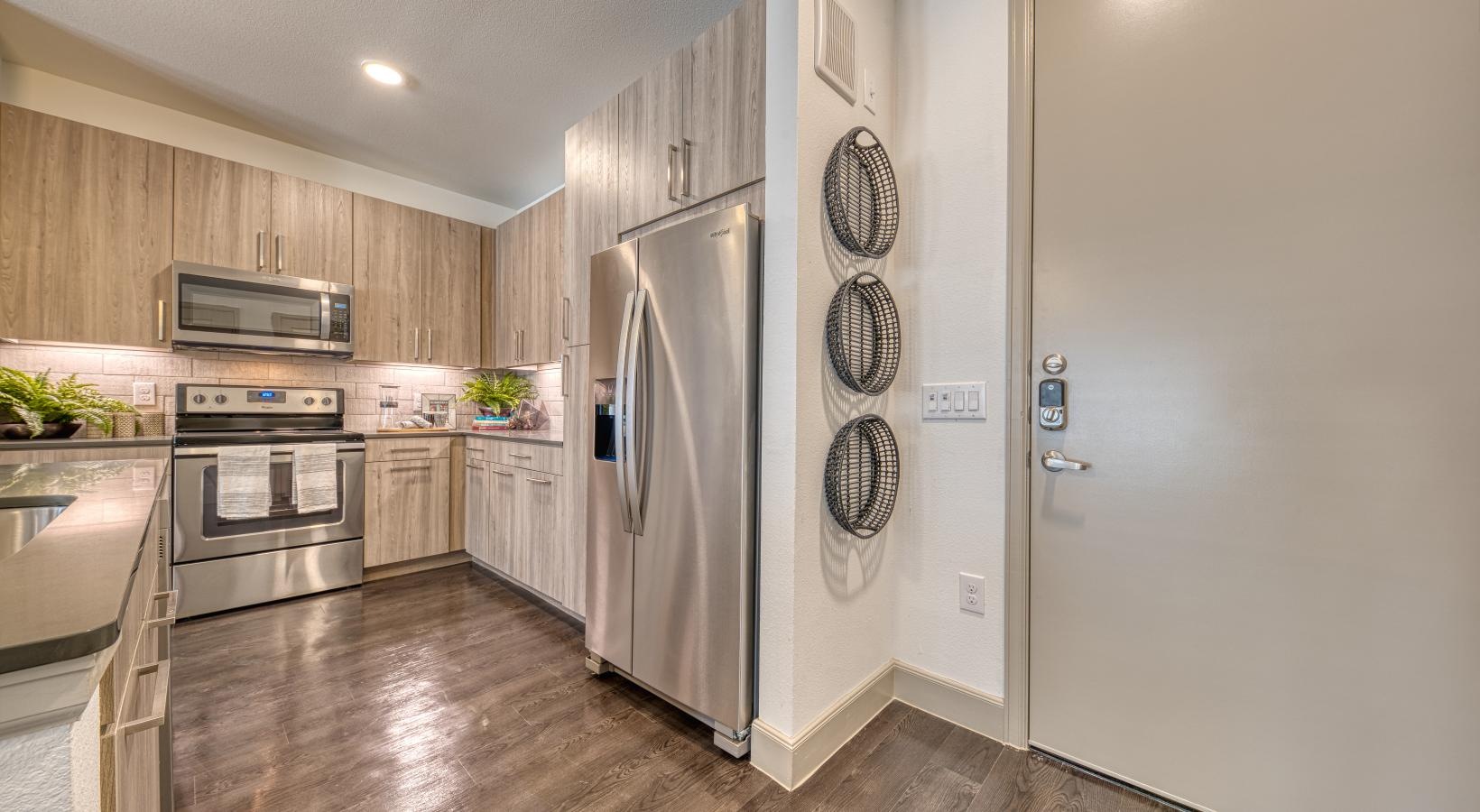 Spacious kitchens with thoughtful details a kitchen with stainless steel appliances