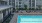 a swimming pool in front of a building